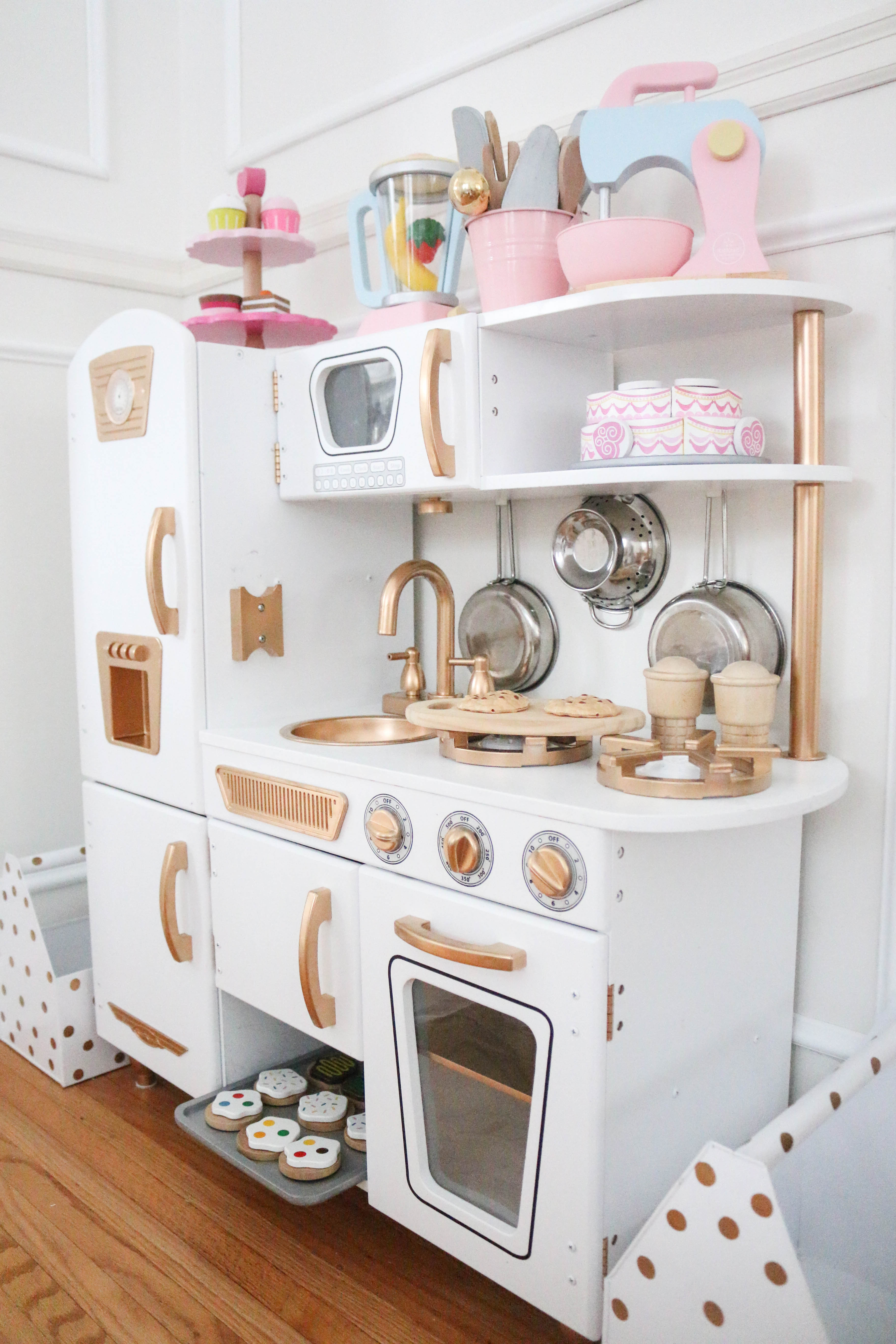 white and gold play kitchen